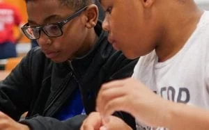 Learning STEM by Battling Robotic Cars and Exploring VR