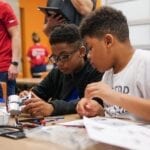 Learning STEM by Battling Robotic Cars and Exploring VR