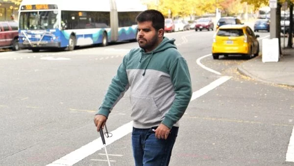 Kartik Sawhney walking on Seattle streets.