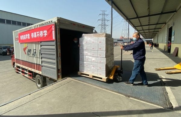 Special packages with tablet, data card, and letter from Yuanqing Yang being loaded for delivery in Hubei Province.