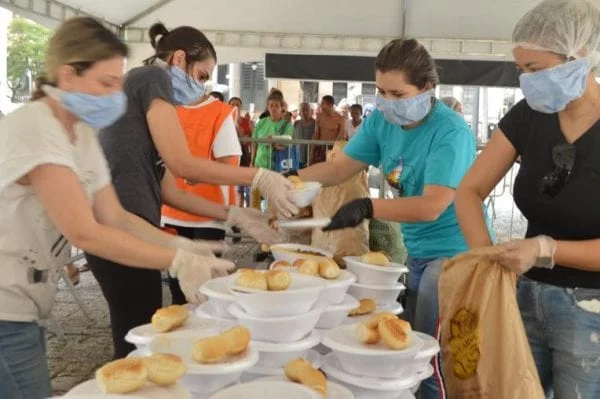 Volunteers assisting the Franciscan monks in providing food to the community during COVID-19