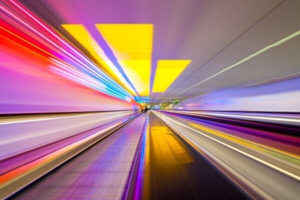 Brand image - colorful lines streaking through a tunnel