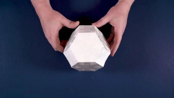 STEM at Home: hands holding the finished hexagon