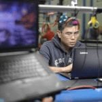 Lenovo employee checking PC in the Whitsett warehouse