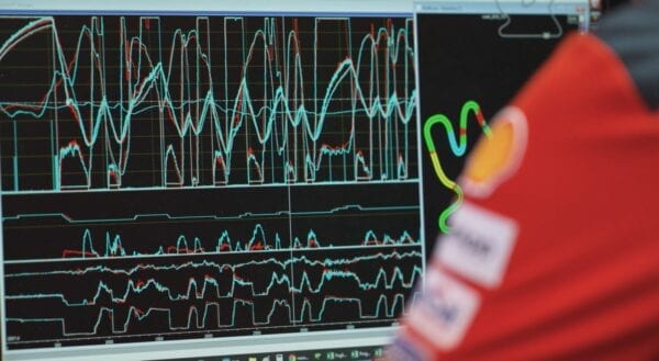 Ducati team member reviewing a data readout on a screen