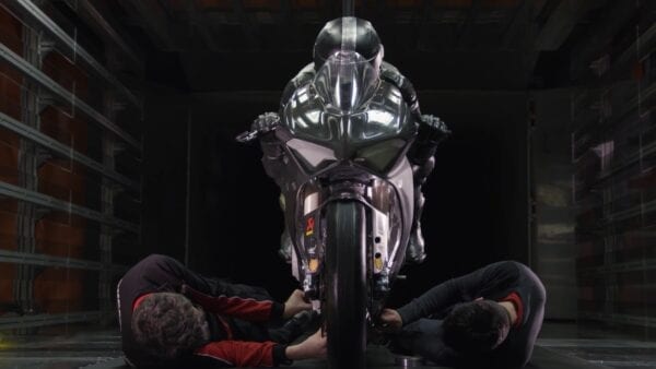 Ducati technicians working on a bike in the garage