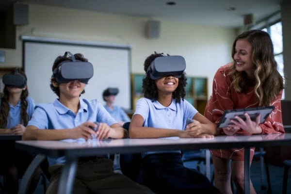 Young students wearing Lenovo VR headsets in school
