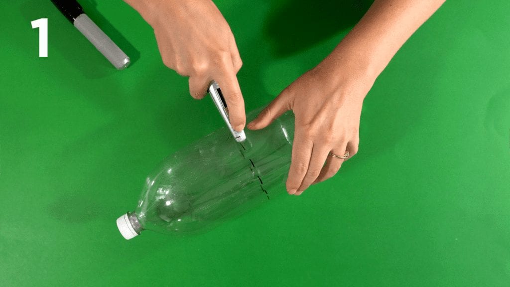 Mark your soda bottle with a marker and cut with utility knife.