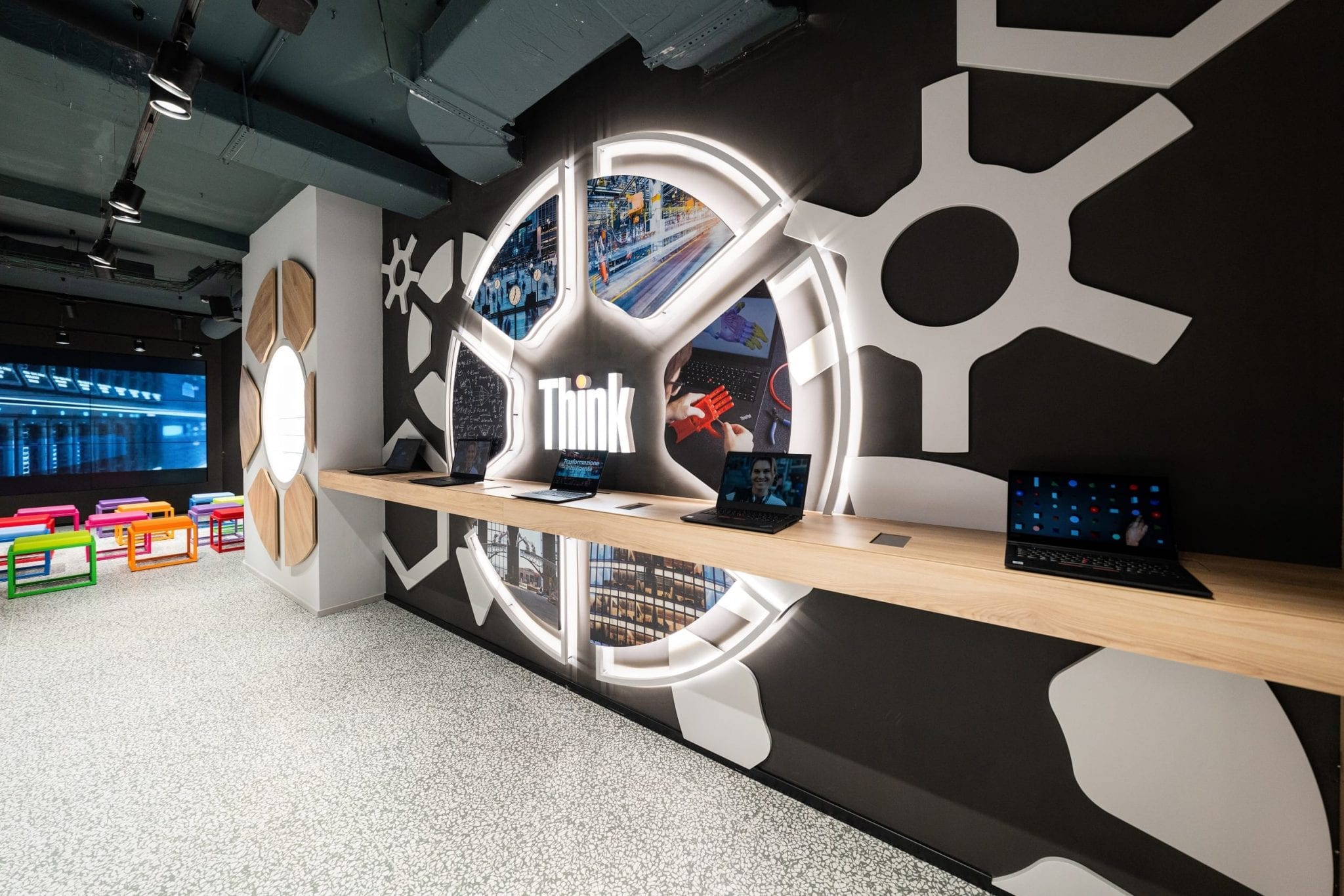 Spazio Lenovo concept store interior showing Think-branded devices and an open auditorium and workspace