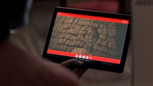 Students on a live video conference using a Lenovo tablet