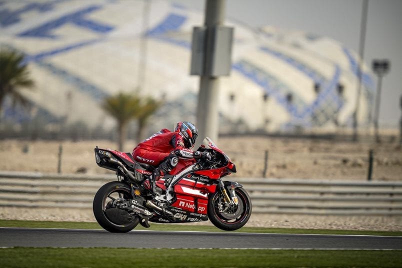 Ducati motorbike racing along a track