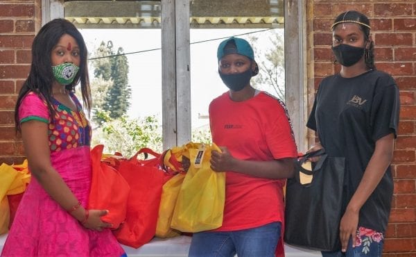 Residents of the St Monica’s Child and Youth Care Centre in South Africa collecting the donated bags of sanitary products.