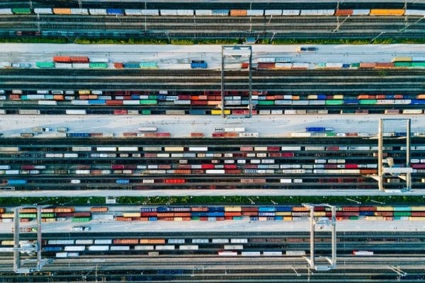 Aerial, overhead view of hundreds of shipping containers.