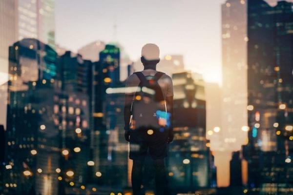 Lenovo brand image of student with backpack and a cityscape overlay
