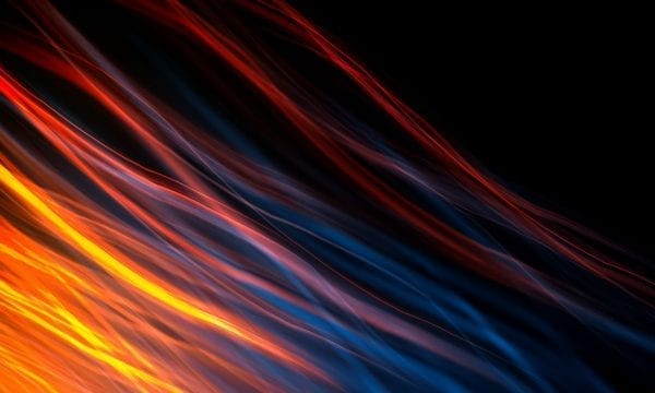Lenovo brand image - trails of fire-like light over black.
