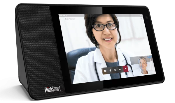 An elderly patient communicating directly with a doctor using a ThinkSmart device