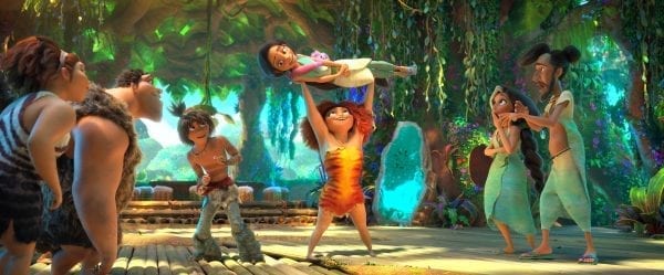 (from left) Ugga Crood (Catherine Keener), Grug Crood (Nicolas Cage), Guy (Ryan Reynolds), Eep Crood (Emma Stone) holding Dawn Betterman (Kelly Marie Tran), Hope Betterman (Leslie Mann) and Phil Betterman (Peter Dinklage) in DreamWorks Animation's "The Croods: A New Age," directed by Joel Crawford.