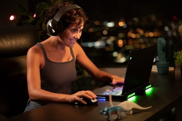 Gamer using a Lenovo Legion PC and the H600 wireless gaming headset.
