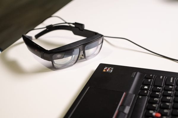 ThinkReality A3 Smart Glasses sitting beside a Lenovo ThinkPad