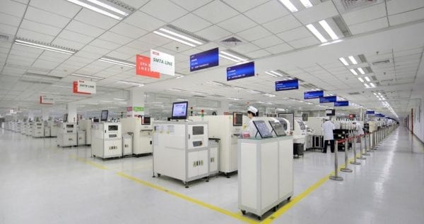 Lenovo's LCFC PC production facility, wide view of different stations in a bright, white warehouse