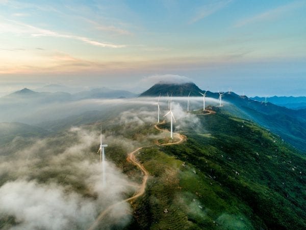 Lenovo brand image - wind turbines along the top ridge of green mountain
