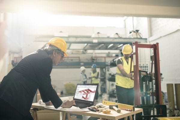 An architect using a ThinkPad P15 at the construction site.