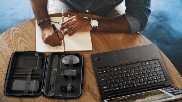 Lenovo Go accessories in tech organizer on table with someone working