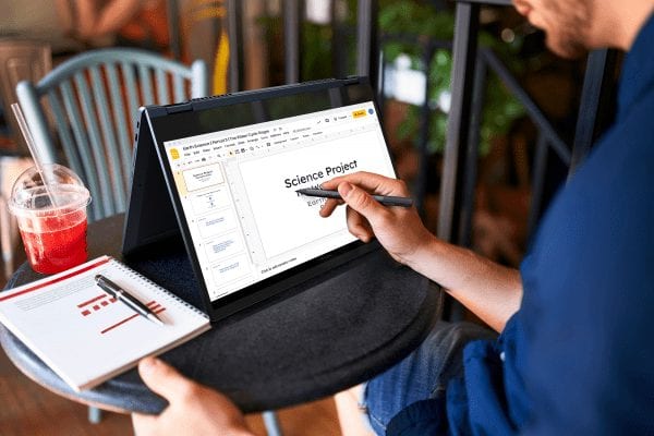 Lenovo IdeaPad Flex 5i Chromebook in tent mode with someone taking notes on the screen