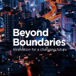 Beyond Boundaries: Innovation for a changing future (text on cityscape at night)