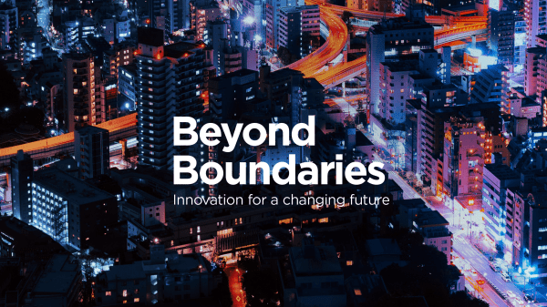 Beyond Boundaries: Innovation for a changing future (text on cityscape at night)