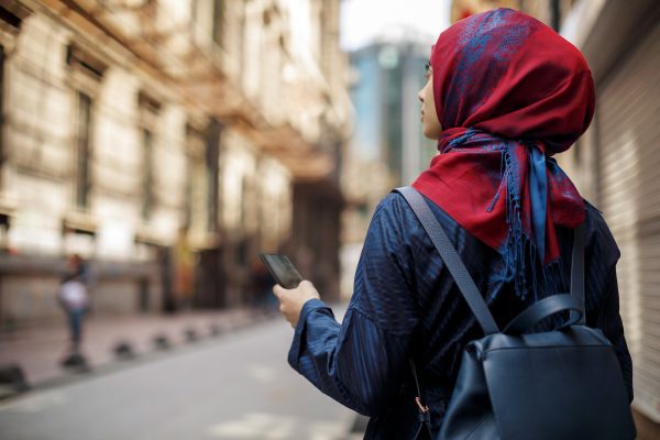 Lenovo brand image - woman exploring a city with smartphone in hand