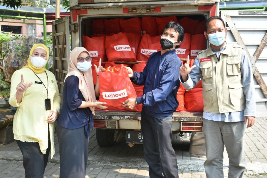 Volunteers unloading supplies at an orphanage in Jakarta