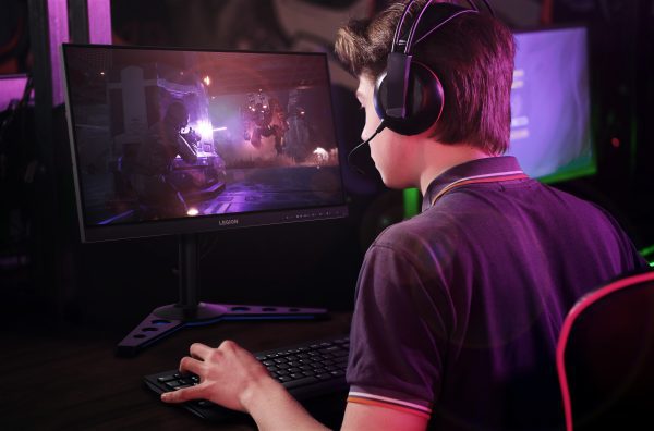 Person playing games on Lenovo Legion Y25g-30 gaming monitor