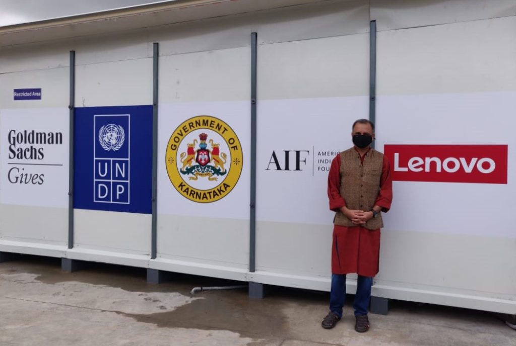 Man standing outside the makeshift COVID-19 facility in Karnataka