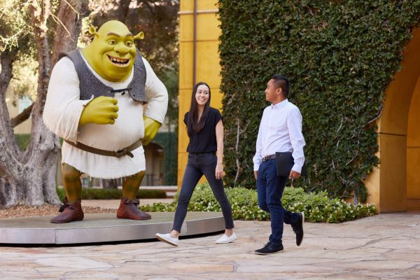 Large Shrek model on DWA campus with people walking past