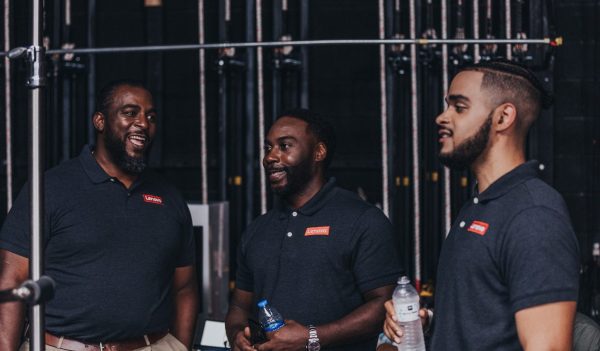 Three Black small business owners wearing Lenovo shirts