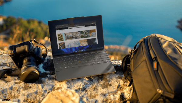 ThinkPad Z13 outdoors with camera and backpack