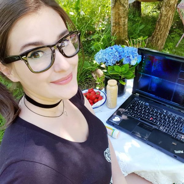 Computer Programmer Working on ThinkPad outside
