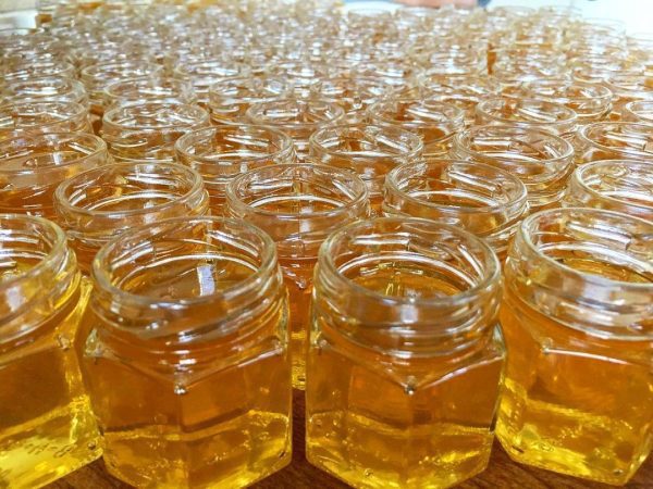 Raw honey in glass containers