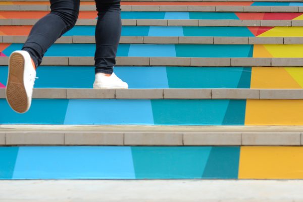 Lenovo brand image - shoes walking up multicolored staircase