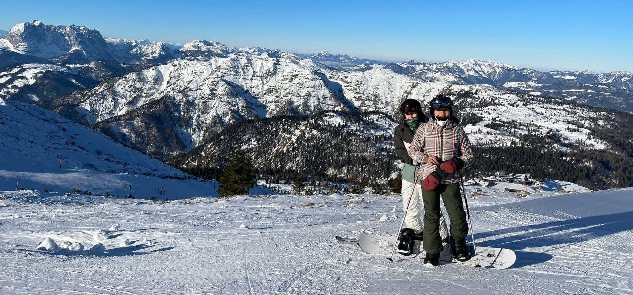 Reina snowboarding with her girlfriend.