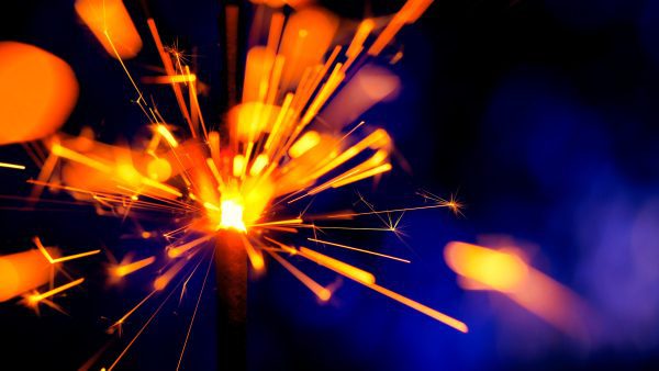 Lenovo brand image: sparkler burst over blue background