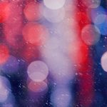 Brand image - Snowy night with red, blue and purple light bokeh.