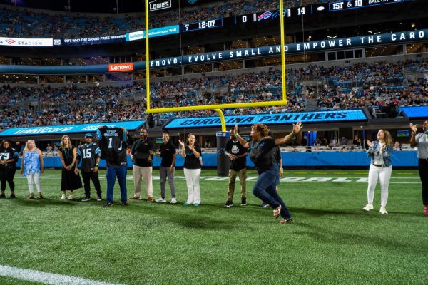 On the Carolina Panthers field, Hip Hop Smoothies of Charlotte names Empowering the Carolinas grand prize recipient!