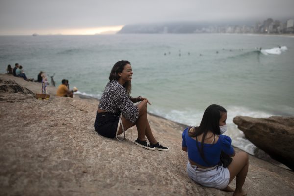 People sitting on the beach in Rio