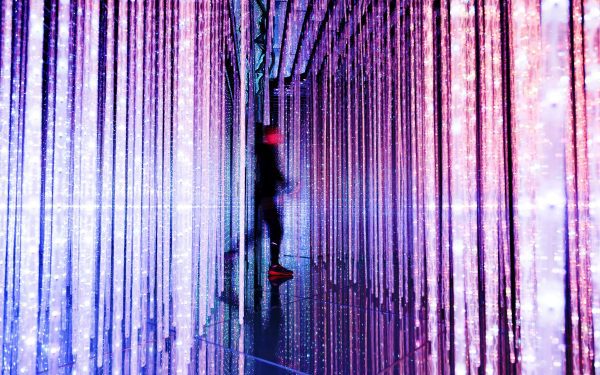 brand image - dazzling strips of light with a blurred person passing through
