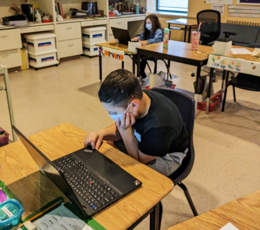 Student using a Lenovo ThinkPad in the classroom.