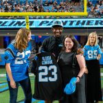 Carolina Panthers Legend Jonathan Stewart and Lenovo Evolve Small’s Megan Bornemann celebrate the 2023 Empowering the Carolinas grand prize recipient, Blush Cowork founder Alison Rogers.