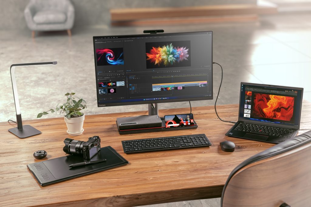 Thinkcentre M90a Pro on a desk with laptop and accessories