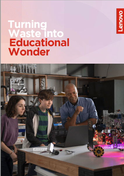 Image of teacher with two students working on a robotics project.